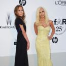 Allegra Versace and Donatella Versace attends amfAR's Cinema Against AIDS Gala during the 64th Annual Cannes Film Festival at Hotel Du Cap on May 19, 2011 in Antibes, France - 405 x 594