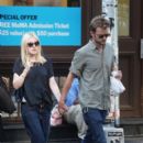 A smitten looking Dakota Fanning and her boyfriend Jamie Strachan go hand in hand for a stroll around New York City - 396 x 594