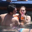 Zoey Deutch in Black Bikini on holiday in Ischia