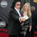 Gene Simmons and Shannon Tweed arrives at the 2007 American Music Awards held at the Nokia Theatre L.A. LIVE on November 18, 2007 in Los Angeles, California - 359 x 594