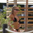 Gabby Allen – In a black bikini by the pool at Nobu Hotel in Ibiza - 454 x 538