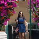 Famke Janssen – In a blue dress steps out in New York
