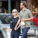 A smitten looking Dakota Fanning and her boyfriend Jamie Strachan go hand in hand for a stroll around New York City - 379 x 594