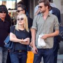 A smitten looking Dakota Fanning and her boyfriend Jamie Strachan go hand in hand for a stroll around New York City - 362 x 594