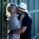 Pamela Anderson was seen kissing husband Rick Salomon on Wednesday July 16, 2014 in Malibu, just 1 week after it was announced she had filed for divorce