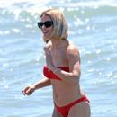 Michelle Hunziker – Seen in Red Bikini at Alpemare Beach in Forte Dei Marmi, Italy - 454 x 681