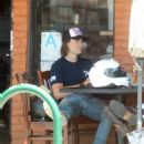 Taylor Kitsch – out on his motorbike - 454 x 636