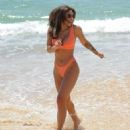 Kayleigh Morris – In orange bikini on the beach in Cyprus - 454 x 544