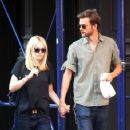 A smitten looking Dakota Fanning and her boyfriend Jamie Strachan go hand in hand for a stroll around New York City - 357 x 594