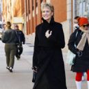 Robin Wright – In a black trench coat and knee long boots in New York - 454 x 678