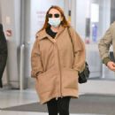 Lindsay Lohan – With husband Bader Shammas catch a flight out of New York