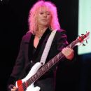 Rick Savage - During Def Leppard’s performance at the Cruzan Amphitheatre in West Palm Beach, Florida on June 15, 2011 - 408 x 612