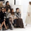 Victoria Beckham and L'Wren Scott attend the Chanel fashion show during Paris Fashion Week (Haute Couture) Spring/Summer 2006 on January 24, 2006 in Paris, France - 454 x 331