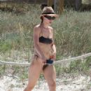 Aurora Ramazzotti – In a black bikini on holiday on the beach in Formentera - 454 x 668