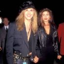 Rikki Rockett and Deanna attend the 18th Annual American Music Awards on January 28, 1991 - 432 x 612