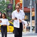 Gigi Hadid – Wearing white shirt as she takes a stroll on the streets of New York