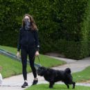 Troian Bellisario – Out for a walk with her dog in Los Angeles - 454 x 479