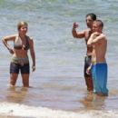 Jennette McCurdy wearing a pretty bikini and board shorts was spotted kayaking with a male friend in Maui