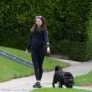 Troian Bellisario – Out for a walk with her dog in Los Angeles - 454 x 492