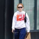 Sadie Sink – Wearing vintage Madonna hoodie while shopping in Manhattan’s Downtown area