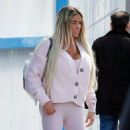 Katie Price &#8211; In a pink outfit with white Louis Vuitton Boots seen at the airport in London