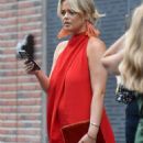 Emily Atack – Wears a red dress as she attends a wedding in Manchester city centre