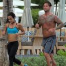 C.M. Punk and AJ Lee jogging together in June 2014 - 446 x 594