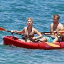 Jennette McCurdy wearing a pretty bikini and board shorts was spotted kayaking with a male friend in Maui