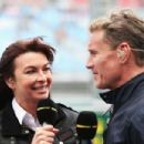 BBC F1 presenter Suzi Perry talks with former F1 driver David Coulthard in the paddock during the weather delayed qualifying session for the Australian Formula One Grand Prix at the Albert Park Circuit on March 17, 2013 in Melbourne, Australia - 454 x 303