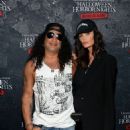 Slash and Meegan attend the “Halloween Horror Nights” Opening Night on September 9, 2021 in Universal City, CA - 454 x 568