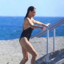 Ines Sastre in Black Swimsuit on the beach in Sotogrande - 454 x 681