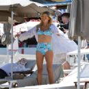 Sophie Monk in Blue Bikini on a beach in Portofino