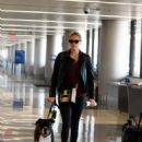 Kate Upton with her dog Harley catches a flight in NY
