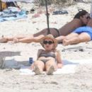 Aurora Ramazzotti – In a black bikini on holiday on the beach in Formentera - 454 x 303