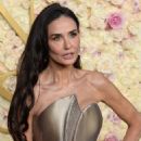 Demi Moore wore a gold dress  at 82nd Annual Golden Globes Awards in Beverly Hills
