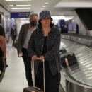 Jennifer Tilly – Waiting for her luggage after her flight into Los Angeles at LAX - 454 x 681