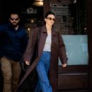Kendall Jenner – In a brown trench coat and blue denim steps out for lunch in New York City