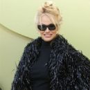 Pamela Anderson wore an eye-catching shimmery black fringe jacket at Versace FW23 Fashion Show at Pacific Design Center in West Hollywood