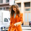Lily Collins – Arrives at the Crosby Hotel in a fashionable red pantsuit in New York