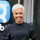 Dame Kelly Holmes – Wearing yellow bomber jacket and blond hair in London - 454 x 681