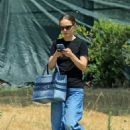Natalie Portman – Running errands in blue jeans and Dior sneakers and bag