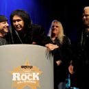 Klaus Meine speaks with host Gene Simmons (C) after receiving the Metal Guru Award during The Classic Rock Roll Of Honour at The Roundhouse on November 9, 2011 in London, England. - 454 x 302
