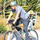 Josh Duhamel is spotted enjoying a bicycle ride with his growing son Axl on January 8, 2016 in Brentwood