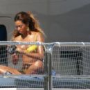 Beyonce Knowles – In a yellow bikini on her yacht in the harbor of the Principality of Monaco - 454 x 301