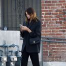 Kaia Gerber – Busy on her phone while leaving a studio in Los Angeles
