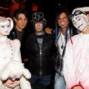 (2nd L-R) Illusionist Criss Angel, guitarist DJ Ashba of Guns N' Roses and artist Michael Godard appear with 