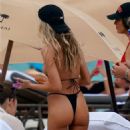 Celeste Bright – in a black bikini at the beach in Miami - 454 x 681