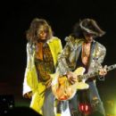 Steven Tyler (left) and Joe Perry (right) performing at the Nassau Coliseum on July 1, 2012 - 454 x 435