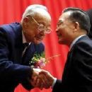 Xu Guangxian (left) being congratulated by Chinese premier Wen Jiabao