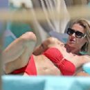 Michelle Hunziker – Seen in Red Bikini at Alpemare Beach in Forte Dei Marmi, Italy - 454 x 303